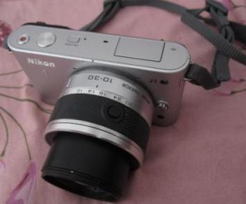 nikon j1 with 10-30mm lens, 4gb memory photo