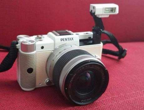 DSLR Pentax Q with 5-15mm lens and accessories