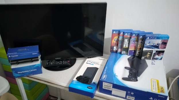 Play Station 4 Slim with Samsung LED TV, Games, Camera, and Stand