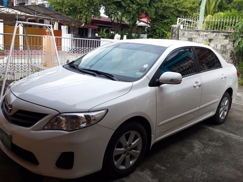 Toyota Altis For sale 2013 model white color, and first owner photo