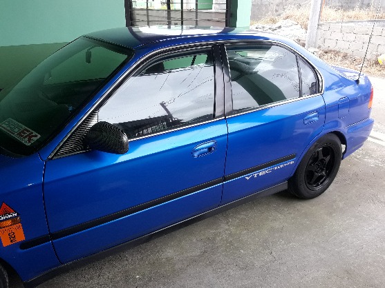 FOR SALE 185K 1997 HONDA CIVIC VTI VTEC MANUAL  VTEC ALL YOU WANT 143000 kilometers Mags Spoon slipstream 15s wrapped with 95% michelin tyres Lambot ng clutch  Fresh na fresh ang dashboard at mga sidings Automatic radiator fan hindi nakarekta Stock Engine Ph16a Cold aircon  All gauges working Central lock  Stanley headlights Stanley tailight and garnish No leaks No overheat  Zero kalampag latang lata paikot  no bulutong Open deed of sale Complete papers Registered until September 2018 Open deed of sale PM OR CALL 09158044783/09198266746 photo