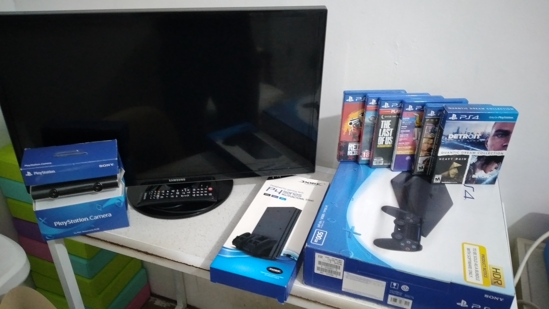 Play Station 4 Slim with Samsung LED TV, Games, Camera, and Stand photo